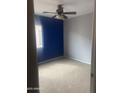 Cozy bedroom with carpet and a ceiling fan at 43845 W Elizabeth Ave, Maricopa, AZ 85138