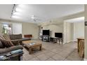 Open living room offers ample seating, a ceiling fan, and plenty of natural light at 4549 W Mclellan Rd, Glendale, AZ 85301