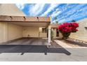 Charming desert home features a two car carport, walkway, and vibrant bougainvillea at 5208 S Deborah Dr, Tempe, AZ 85283