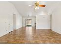 Bright living room with tile flooring, and sliding glass doors leading to the backyard at 5852 E Enrose St, Mesa, AZ 85205