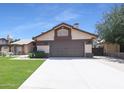 Inviting two-story home with a well-maintained lawn and a spacious two-car garage at 6101 W Grandview Rd, Glendale, AZ 85306
