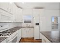 This lovely kitchen includes new appliances, sleek countertops and bright lighting at 7807 E Main St # F36, Mesa, AZ 85207