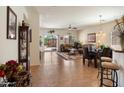 Open concept living area featuring tile floors, ample natural light, and seamless access to the outdoor patio at 125 N 107Th Dr, Avondale, AZ 85323