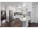 Open kitchen design with granite countertops, stainless appliances and adjacent living area at 1654 S 77Th St, Mesa, AZ 85209