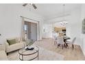 Open concept living and dining area with natural light and sliding glass door to the outdoor balcony at 20801 N 90Th Pl # 271, Scottsdale, AZ 85255