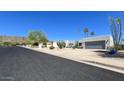 Southwest home with desert landscaping, mountain views and a two car garage at 2426 E Turquoise Dr, Phoenix, AZ 85028