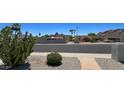 Front yard of home with desert landscaping and mountain views in the distance at 2426 E Turquoise Dr, Phoenix, AZ 85028