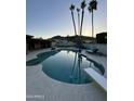 Backyard swimming pool and patio with a diving board and mountain views at 2426 E Turquoise Dr, Phoenix, AZ 85028