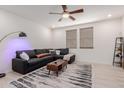 Comfortable living room featuring a plush gray sectional, modern decor, and stylish rug at 2660 S Equestrian Dr # 103, Gilbert, AZ 85295