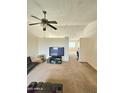 Inviting living room with neutral carpet and ceiling fan for added comfort at 3002 W Tonopah Dr, Phoenix, AZ 85027