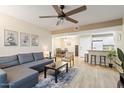Comfortable living room leading to the eat-in kitchen, dining area, and features modern décor at 540 N May -- # 2110, Mesa, AZ 85201