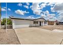 Inviting single-story home featuring a two-car garage and a low-maintenance yard, ideal for comfortable living at 5818 E Colby St, Mesa, AZ 85205