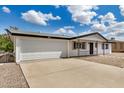 Lovely single-story home with a two-car garage, a well-manicured yard, and inviting curb appeal at 5818 E Colby St, Mesa, AZ 85205