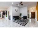 Bright living room featuring modern furniture, ceramic tile floor, and plenty of space at 5922 W Michelle Dr, Glendale, AZ 85308