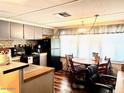 Functional kitchen and dining area with essential appliances, ample storage, and a bright, inviting space at 5933 E Main St # 114, Mesa, AZ 85206