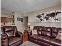 Relaxing living area with hardwood floors, comfortable seating, and stylish decor at 5995 N 78Th St # 1047, Scottsdale, AZ 85250
