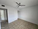Bedroom featuring tile floors and a ceiling fan at 6901 W Mackenzie Dr # 1287, Phoenix, AZ 85033