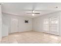 Bright living room with neutral walls, tile flooring, and lots of natural light at 6901 W Mackenzie Dr # 1287, Phoenix, AZ 85033