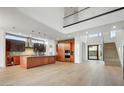 Modern kitchen featuring an island, stainless steel appliances, and hardwood floors at 100 W Northern Ave # 7, Phoenix, AZ 85021