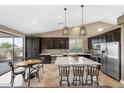 Bright kitchen featuring a large island, pendant lighting, stainless steel appliances, and breakfast area at 10623 E Acacia Dr, Scottsdale, AZ 85255