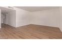 Bright living room with new light wood floors and neutral paint at 1115 E Carter Dr, Tempe, AZ 85282