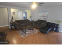 Inviting living room with hardwood floors and a comfortable seating area at 11770 W Aster Dr, El Mirage, AZ 85335