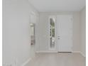 Bright foyer with a white front door and neutral tile flooring and natural light at 1272 W Camina Buena Vis, Queen Creek, AZ 85140