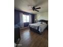 Comfortable bedroom with a large window, stylish decor, and a relaxing ambiance at 1954 E Nielson Ave, Mesa, AZ 85204