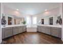 Well-appointed bathroom with double vanities and a luxurious soaking tub at 25051 N 140Th Dr, Surprise, AZ 85387