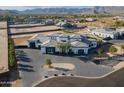 Aerial view showcasing the modern design of the luxury home and circular driveway at 3518 N 201St Ln, Buckeye, AZ 85396