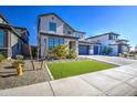 Charming two-story home with a three car garage, manicured lawn, and desert landscaping at 4507 S 119Th Dr, Avondale, AZ 85323