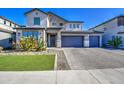 Charming two-story home with a three car garage, manicured lawn, and desert landscaping at 4507 S 119Th Dr, Avondale, AZ 85323