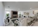 Spacious living room with modern decor, fireplace, and lots of natural light at 4507 S 119Th Dr, Avondale, AZ 85323