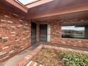 Inviting front entrance featuring brick accents, dual security doors, and desert landscaping at 4537 E Emelita Ave, Mesa, AZ 85206