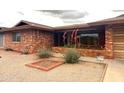 Beautiful brick home showcasing drought tolerant landscaping and a welcoming front yard at 4537 E Emelita Ave, Mesa, AZ 85206