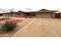 Lovely home with desert landscaping, a tidy front yard, and a concrete driveway at 4537 E Emelita Ave, Mesa, AZ 85206