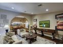 Comfortable seating arrangement in a cozy living room with a dining area at 5672 E Beverly Ln, Scottsdale, AZ 85254