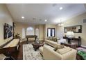 Spacious living room with a large rug, plush sofas, and plenty of natural light at 5672 E Beverly Ln, Scottsdale, AZ 85254