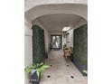 Charming entryway features tile flooring, bench, and greenery for a welcoming touch at 8935 N 82Nd St, Scottsdale, AZ 85258