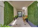 Inviting foyer featuring tiled floors, green walls, a skylight, and a seating area at 8935 N 82Nd St, Scottsdale, AZ 85258