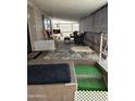 Relaxing covered patio with comfortable seating and stylish rugs at 9501 E Broadway Rd # 21, Mesa, AZ 85208