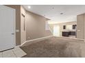 Cozy living room featuring neutral carpet and a view into the kitchen at 1367 S Country Club Dr # 1299, Mesa, AZ 85210