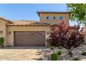 Beautiful shot of a home's exterior with a two-car garage and decorative landscaping at 1508 N Alta Mesa Dr # 120, Mesa, AZ 85205