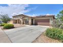 An inviting single-Gathering home boasting a desert landscape, two-car garage, and tile roof at 1652 E Judi St, Casa Grande, AZ 85122