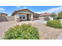 Single-Gathering home showcasing desert landscaping, a tile roof, and a well-maintained front yard at 1652 E Judi St, Casa Grande, AZ 85122