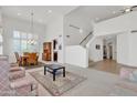 Spacious living area featuring high ceilings and access to the staircase at 1951 W Bartlett Ct, Chandler, AZ 85248