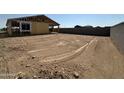 New home under construction, features an expansive backyard with potential for landscaping and outdoor living space at 2300 E Spur Dr, San Tan Valley, AZ 85140