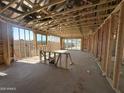 Spacious interior under construction, featuring a modern open-concept design with exposed beams and ample natural light at 2300 E Spur Dr, San Tan Valley, AZ 85140