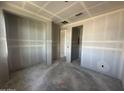 Hallway with unfinished walls and ceilings, highlighting the layout and flow of the home's interior spaces at 2325 E Homesteader Rd, San Tan Valley, AZ 85140
