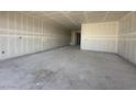 Expansive living room with unfinished walls and floors, providing a blank canvas for personalization and design at 2325 E Homesteader Rd, San Tan Valley, AZ 85140
